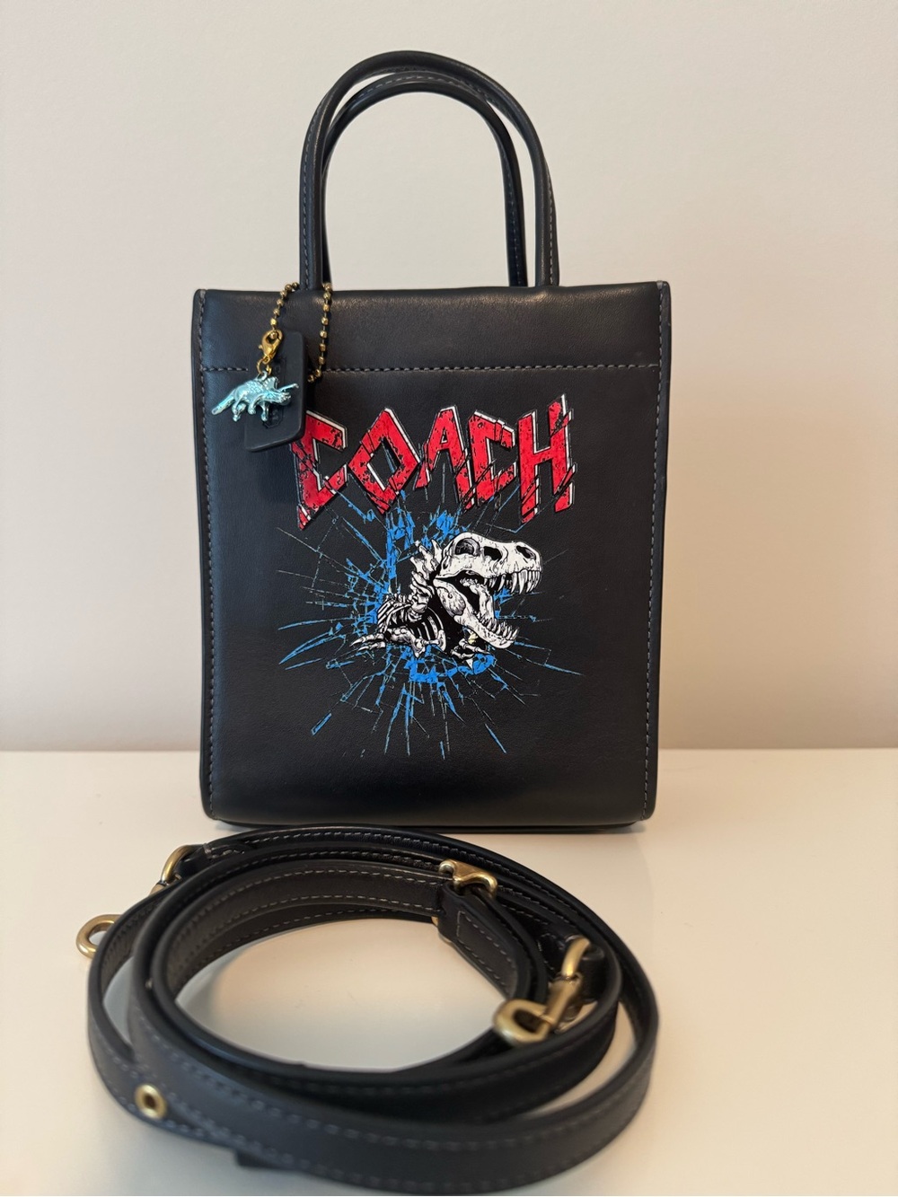 Coach customized mini cashin tote with rexy graphic and dinosaur charm